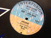 Jackie – Under Fire 12" vinyl record, image 2 of 2