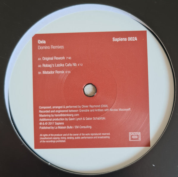 Oxia – Domino Remixes 12" vinyl record, image 1 of 3