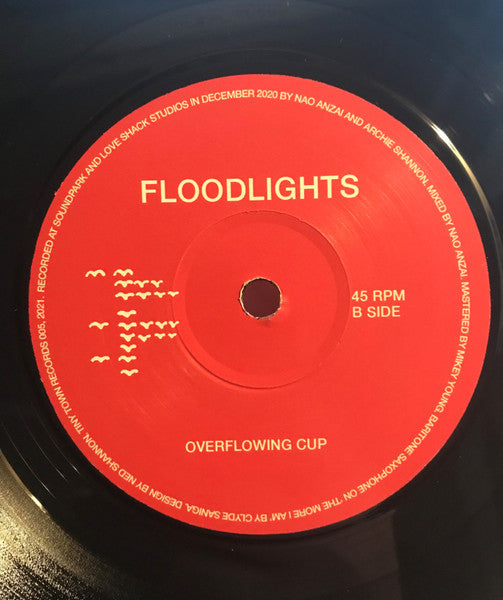 Floodlights – The More I Am / Overflowing Cup 7" vinyl record, image 4 of 4